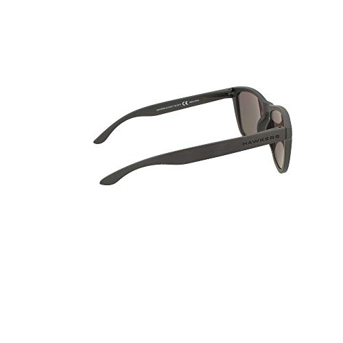 HAWKERS Gafas de Sol ONE Carbon Black, para Hombre y Mujer, con Montura Negra Mate y Lente Rosa Dorada Efecto Espejo, Protección UV400